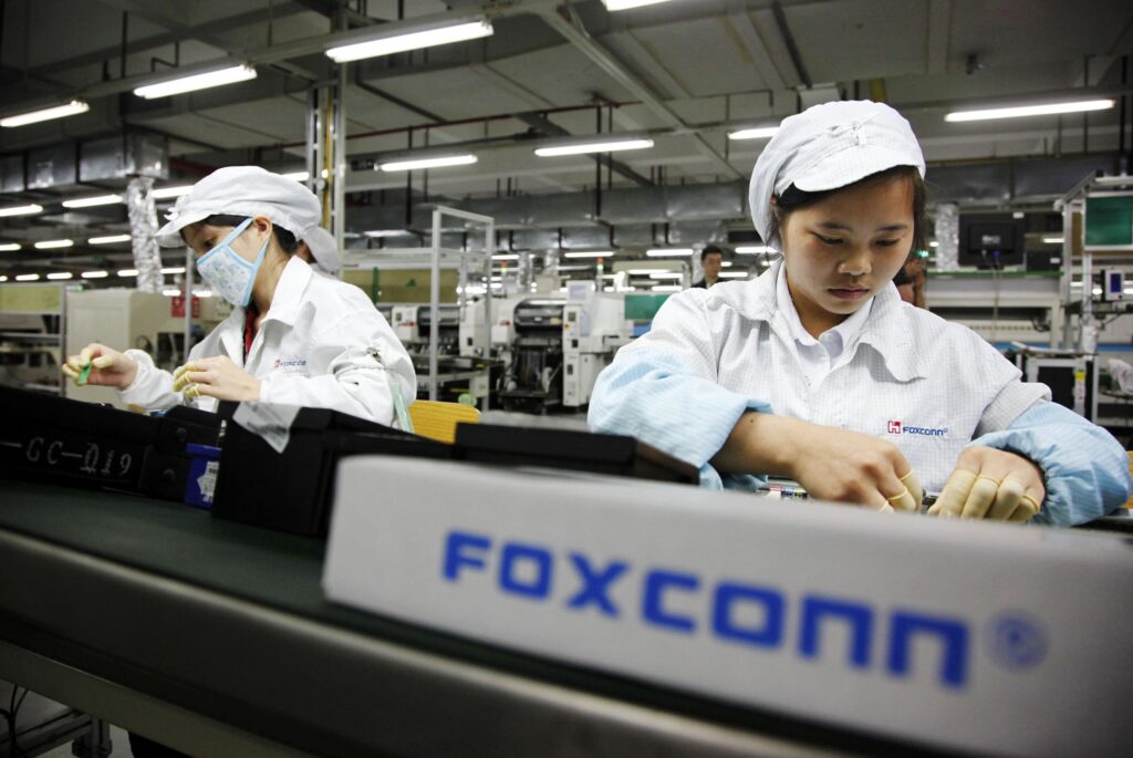 100642777-foxconn-worker-assembly-line-gettyp-scaled