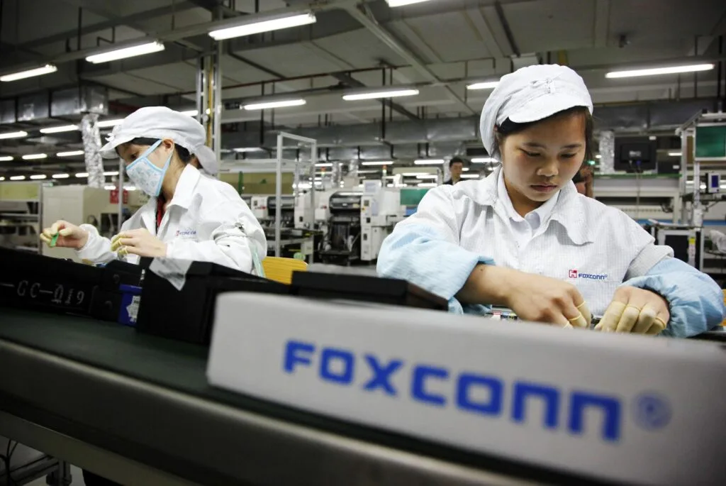 100642777-foxconn-worker-assembly-line-gettyp-scaled