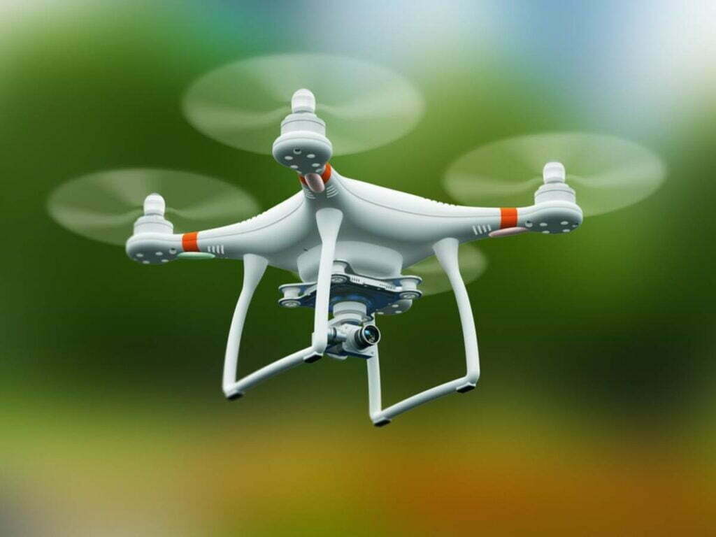 Quadcopter drone with 4K video camera flying in the air