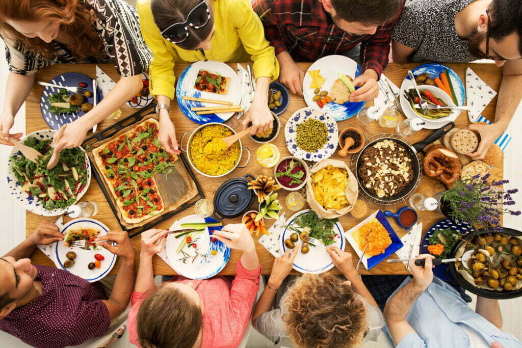 Vegan friends eating healthy dinner