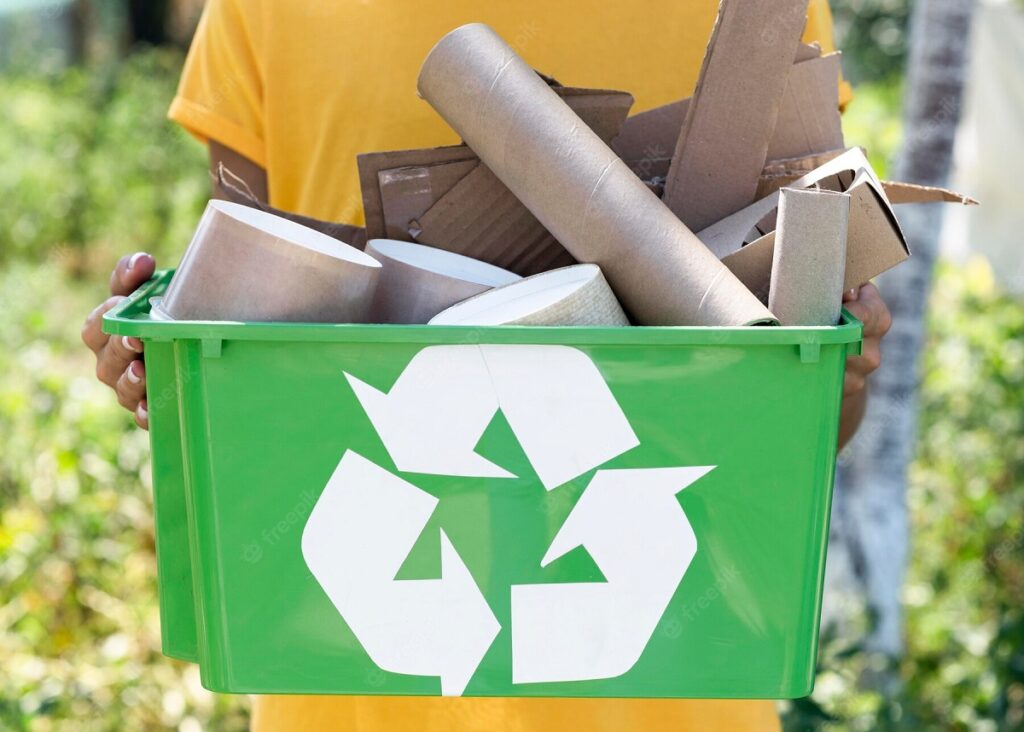 front-view-individual-holding-recycle-produts_23-2148666774