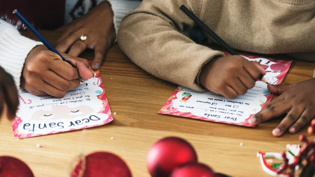kid-writing-christmas-wish-list-772406602.jpg