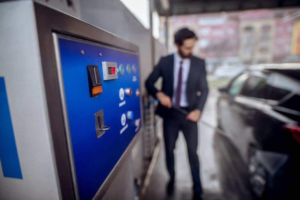 Close,Up,Focus,View,Of,Coin,Machine,While,Stylish,Bearded