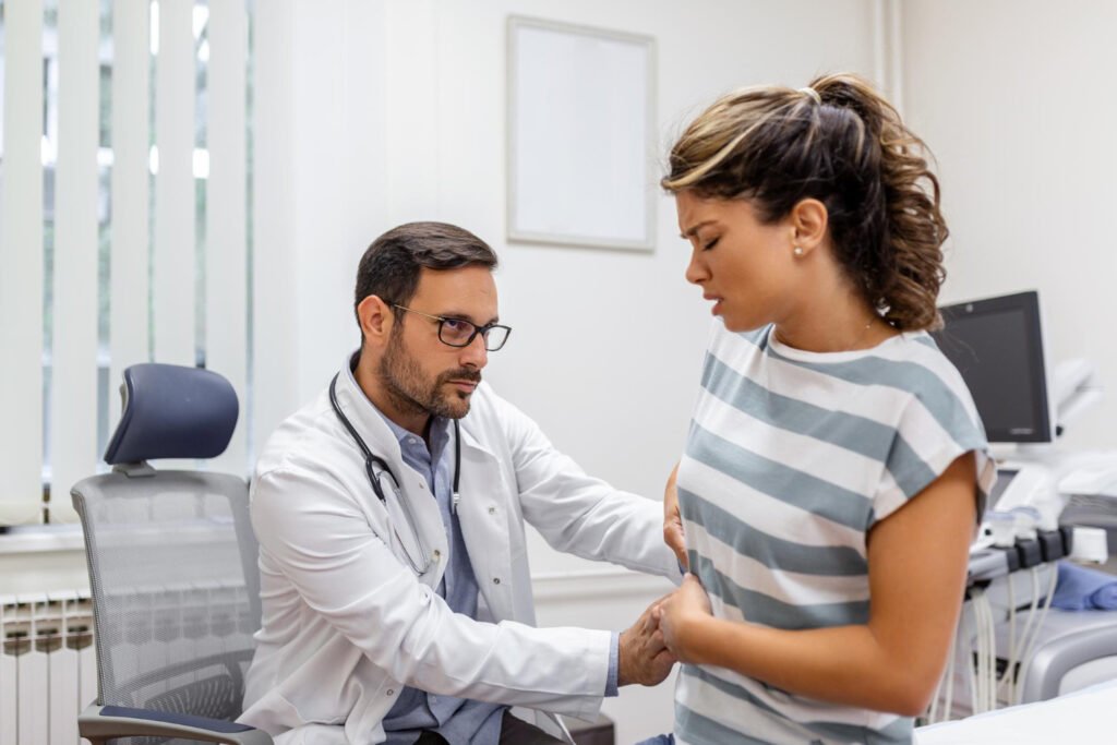 patient-telling-physician-about-her-pain-health-problems-during-visit-hosp...office
