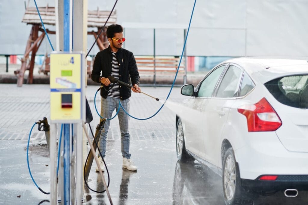 south-asian-man-indian-male-washing-his-white-transportation-car-wash